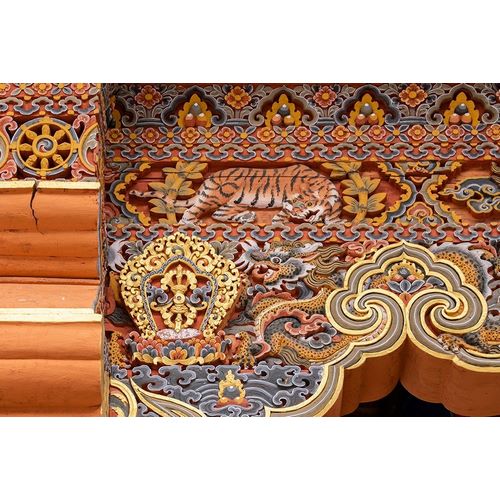 Bhutan Traditional hand painted and carved wooden architectural detail with tiger and dragon